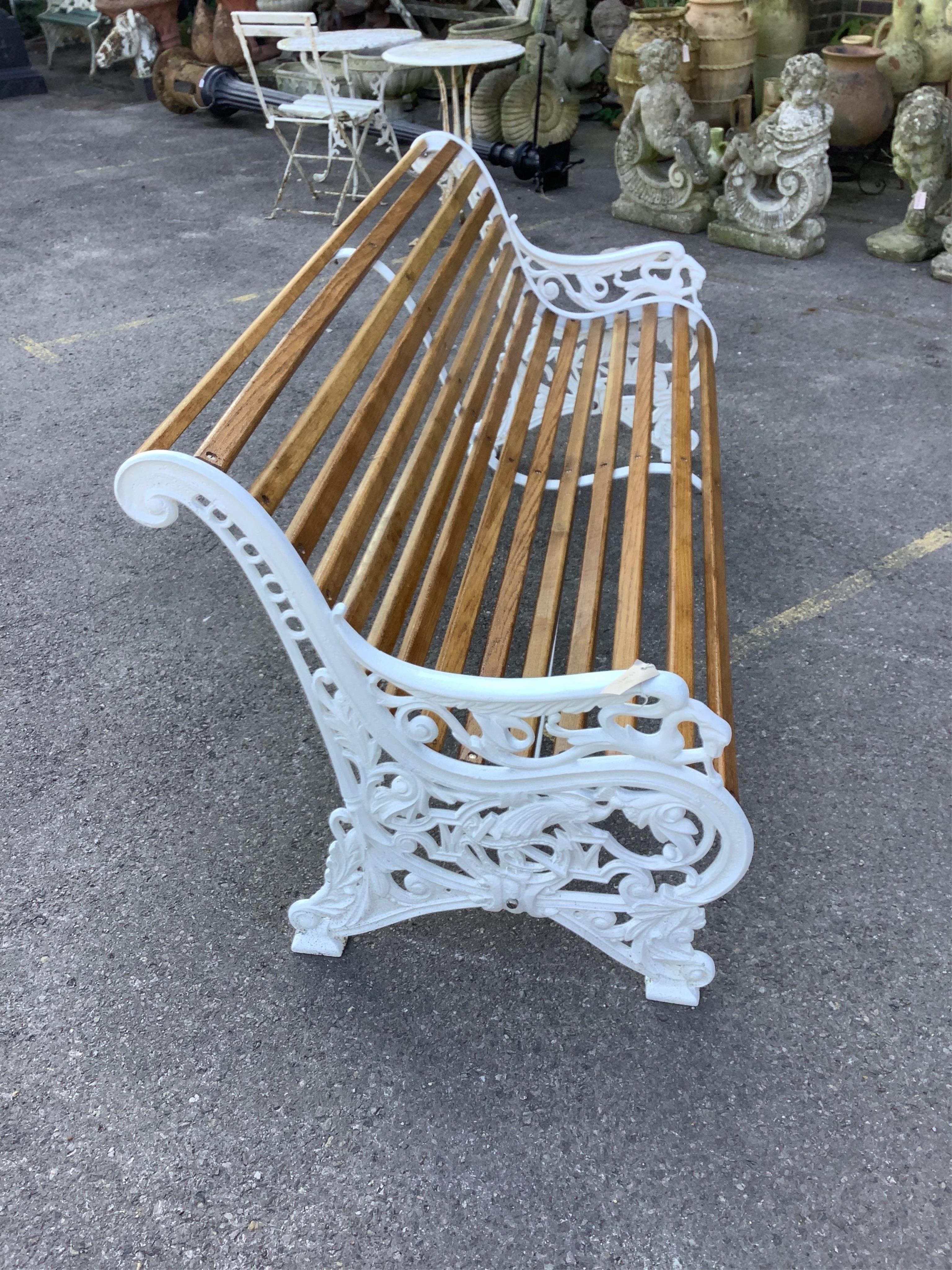 A Victorian style Coalbrookdale design cast iron garden bench (fully restored with varnished oak slats), width 178cm, depth 70cm, height 80cm. Condition - very good